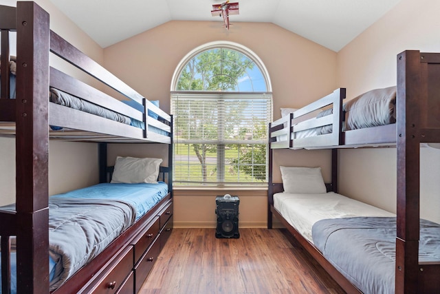 bedroom with hardwood / wood-style flooring and vaulted ceiling