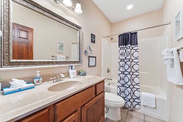 full bathroom featuring tile patterned flooring, vanity, toilet, and shower / bath combo with shower curtain