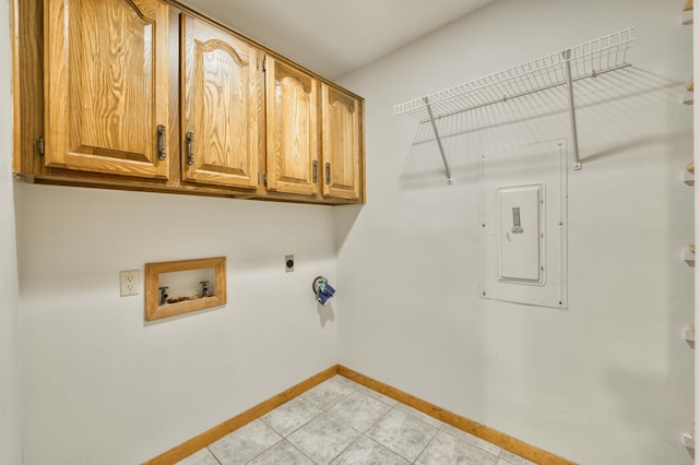 washroom featuring hookup for a washing machine, cabinets, electric panel, and electric dryer hookup