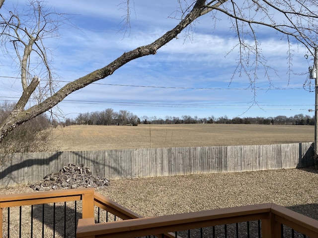 view of yard with a rural view