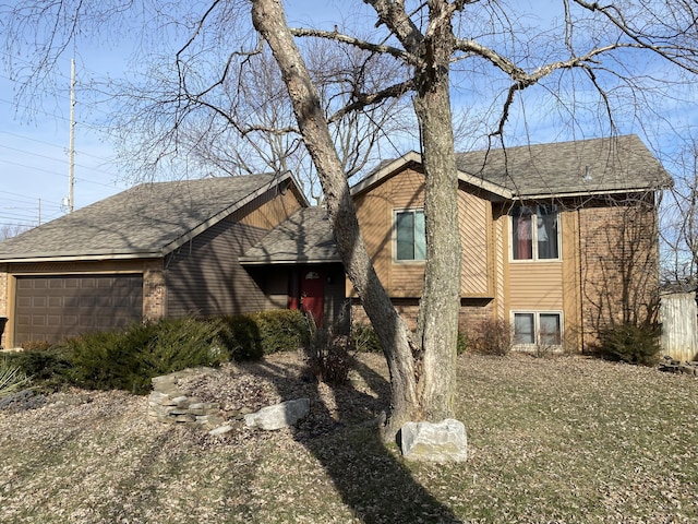 view of front of home featuring a garage and a front yard