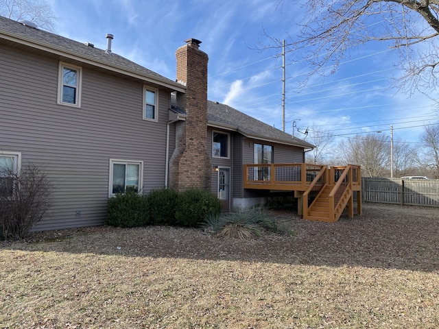 rear view of property with a wooden deck