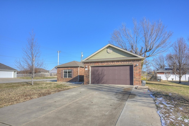 single story home with a front lawn and a garage