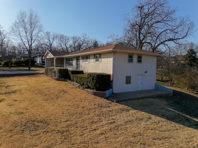 view of property exterior with a lawn