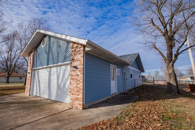 view of property exterior with a garage