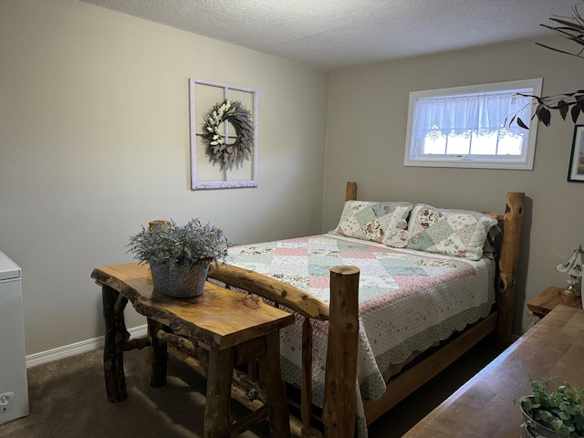 bedroom with carpet flooring and a textured ceiling