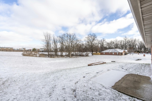 view of yard layered in snow