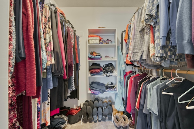 spacious closet with carpet flooring