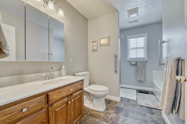 full bathroom featuring plus walk in shower, vanity, a textured ceiling, and toilet