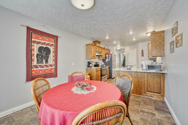 dining room with a textured ceiling