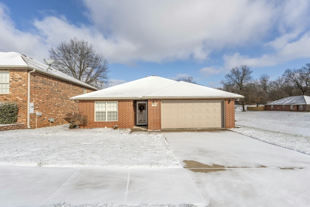 ranch-style home featuring a garage