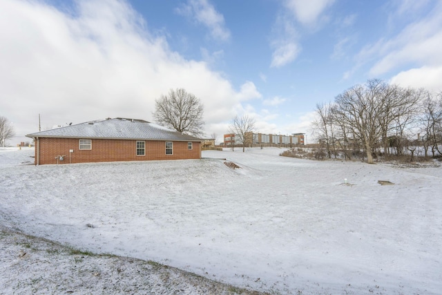 view of yard covered in snow