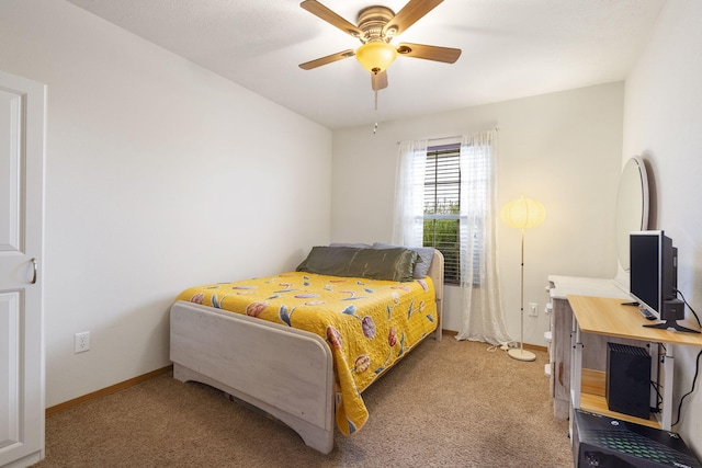 bedroom featuring light carpet, baseboards, and a ceiling fan