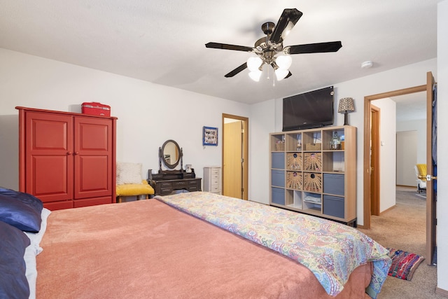 bedroom featuring light carpet and a ceiling fan