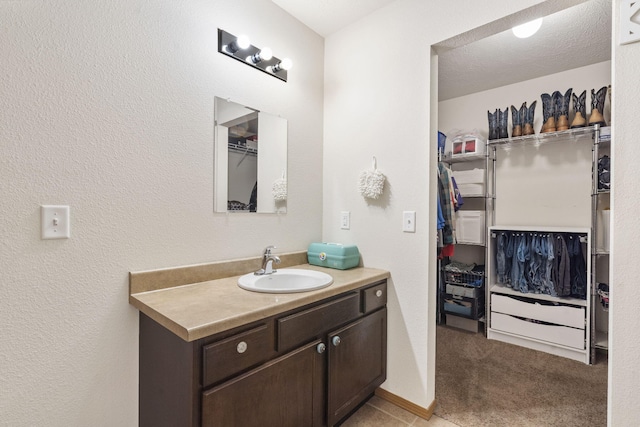 bathroom featuring vanity and baseboards