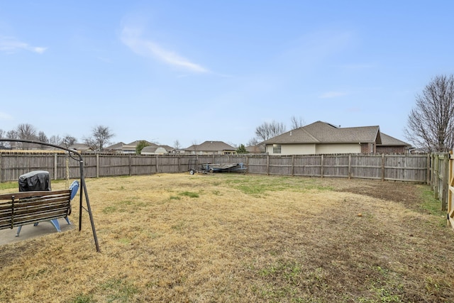 view of yard with a fenced backyard