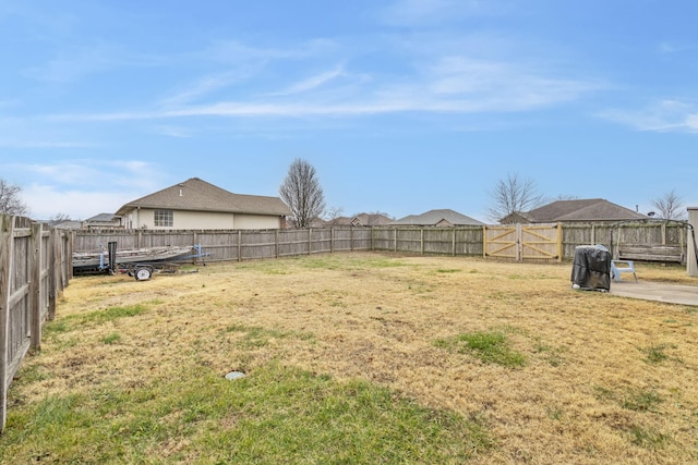 view of yard with a fenced backyard