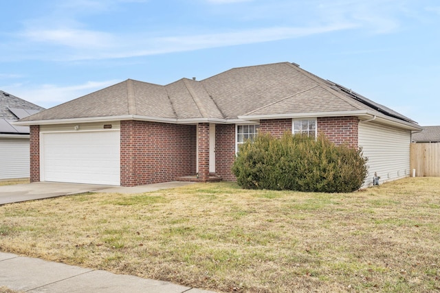 single story home with a garage, concrete driveway, brick siding, and a shingled roof