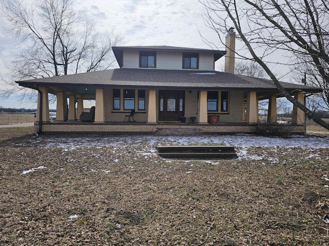 back of house featuring covered porch