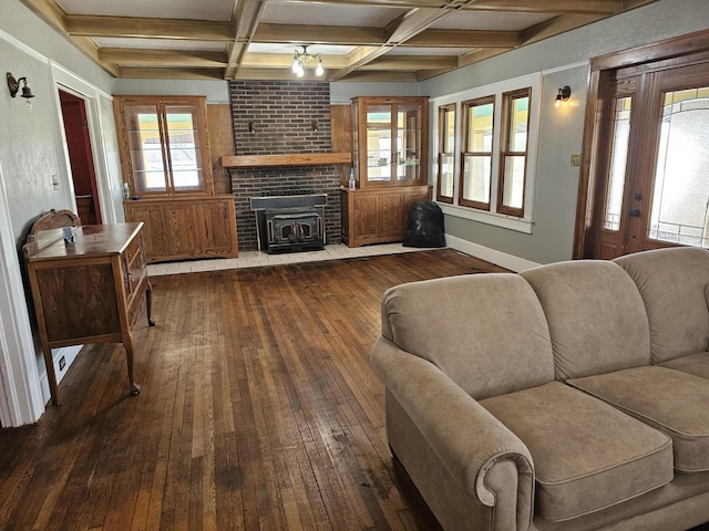 living room featuring coffered ceiling, wood-type flooring, and beamed ceiling