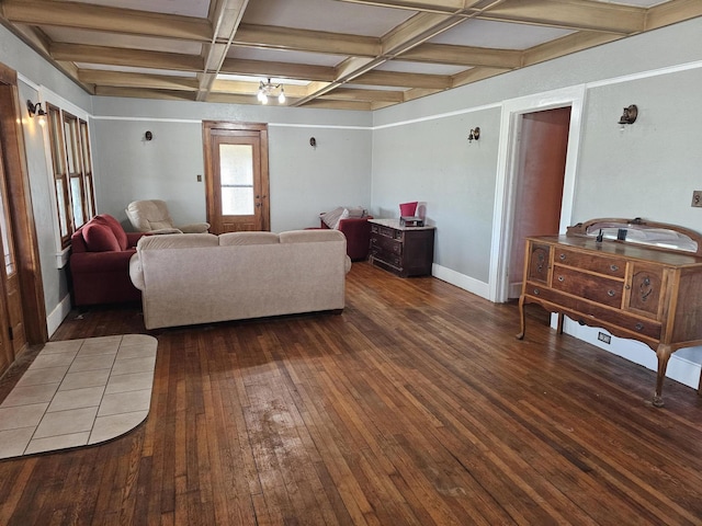 living room featuring coffered ceiling, dark hardwood / wood-style flooring, and beam ceiling