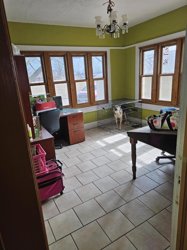 office space with a wealth of natural light, a chandelier, and light tile patterned floors