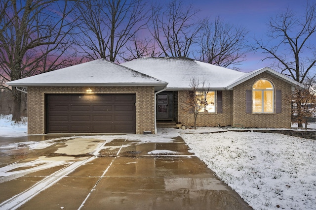 ranch-style home featuring a garage