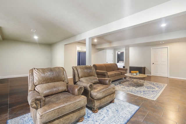 living room featuring recessed lighting and baseboards