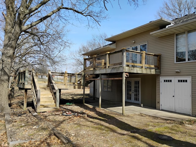 back of house with stairway, french doors, a patio, and a deck