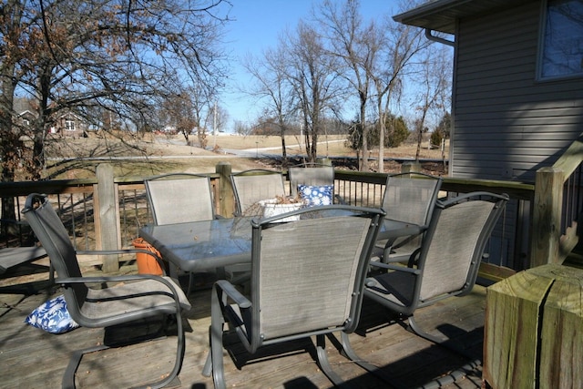 wooden deck featuring outdoor dining space