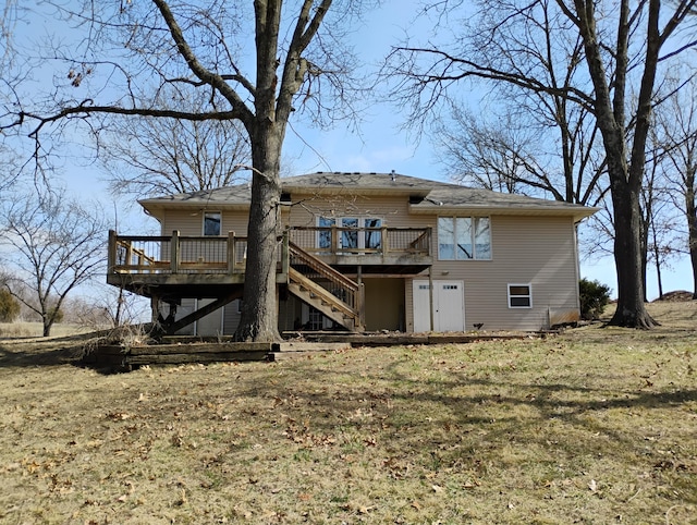 back of house featuring stairway and a deck