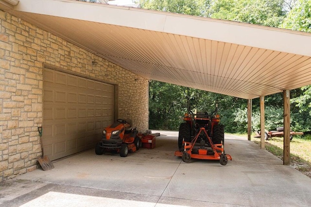 view of parking with a carport and a garage