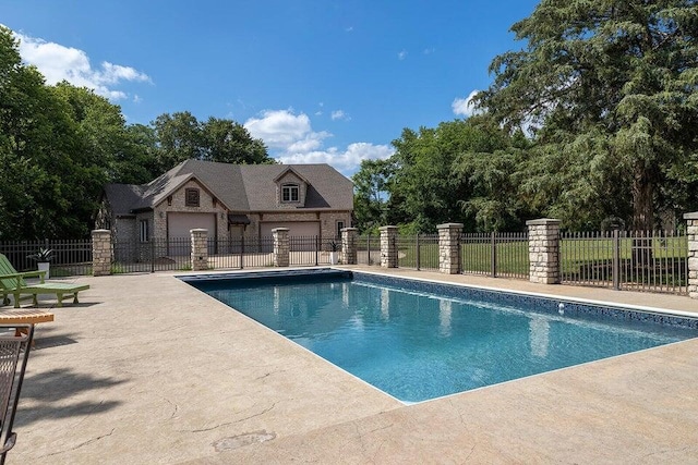 view of swimming pool with a fenced in pool and fence