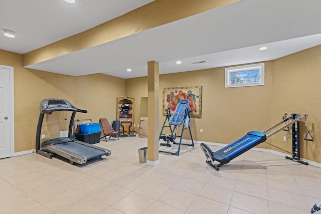 workout room featuring recessed lighting, tile patterned floors, a textured wall, and baseboards