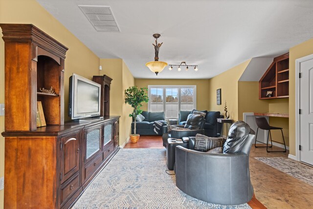 living area featuring visible vents
