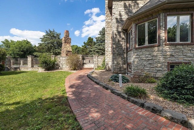 view of yard with fence and a gate