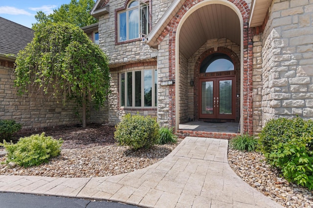 entrance to property with french doors and brick siding