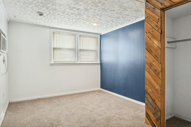 unfurnished bedroom featuring carpet flooring and ornamental molding