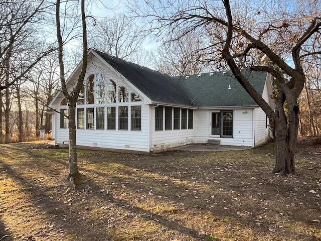 rear view of house featuring a patio