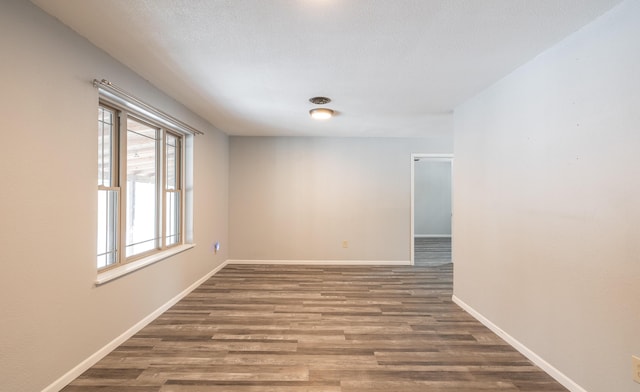 empty room featuring dark hardwood / wood-style floors