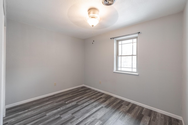 unfurnished room with dark hardwood / wood-style floors