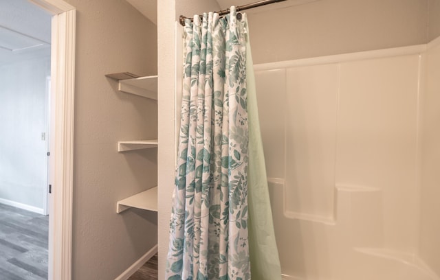 bathroom featuring a shower with curtain