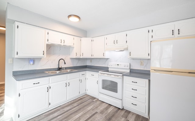 kitchen featuring sink, white cabinets, white appliances, and light wood-type flooring