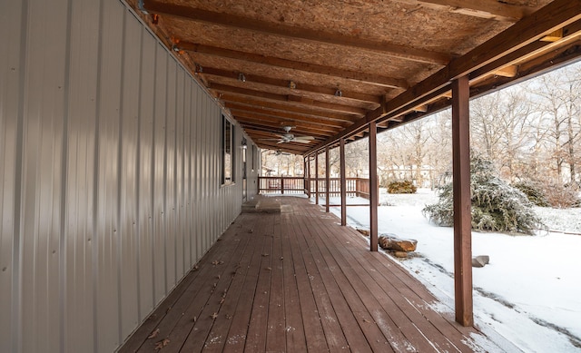 snow covered deck with covered porch