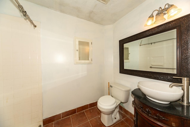 bathroom with walk in shower, tile patterned flooring, vanity, and toilet