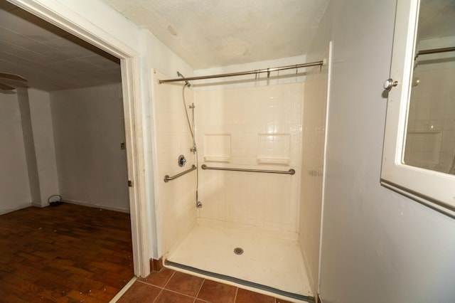 bathroom featuring tile patterned flooring and a shower