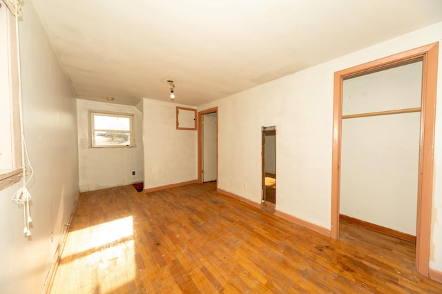 unfurnished bedroom featuring hardwood / wood-style flooring