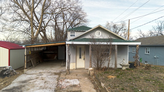 bungalow-style home with a carport