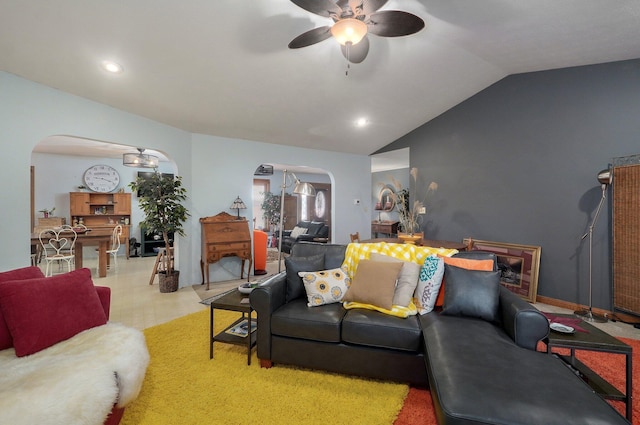 living room with ceiling fan and lofted ceiling