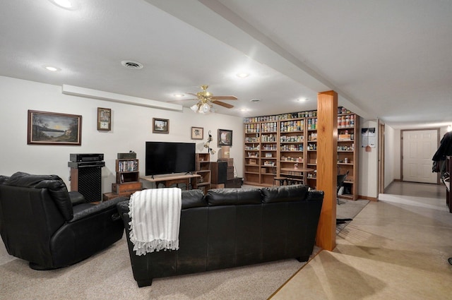 living room featuring light carpet and ceiling fan